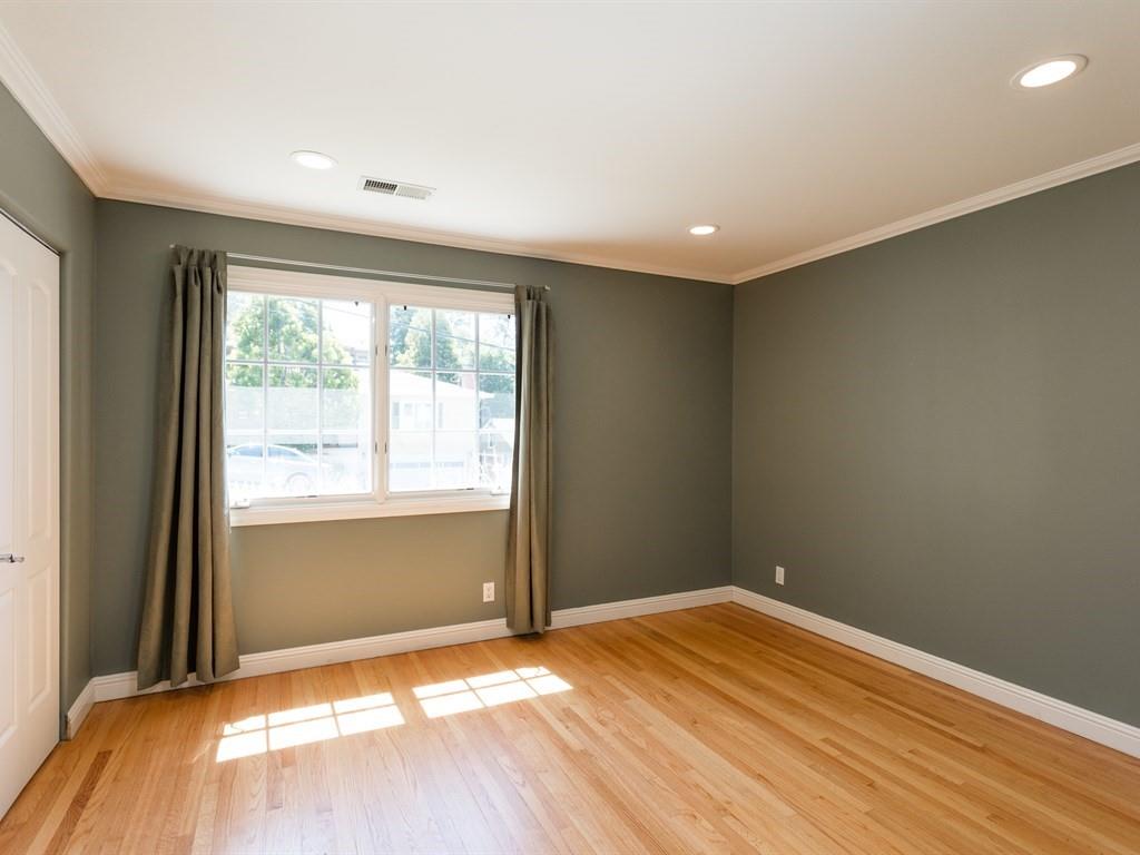 10 Kenton Avenue San Carlos, CA 94070 - Photo 12 of 25 a view of empty room with wooden floor and fan
