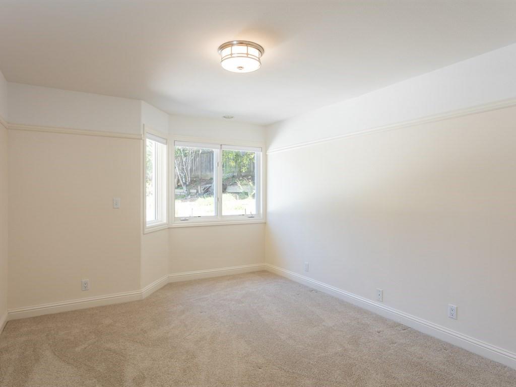 10 Kenton Avenue San Carlos, CA 94070 - Photo 15 of 25 an empty room with a window