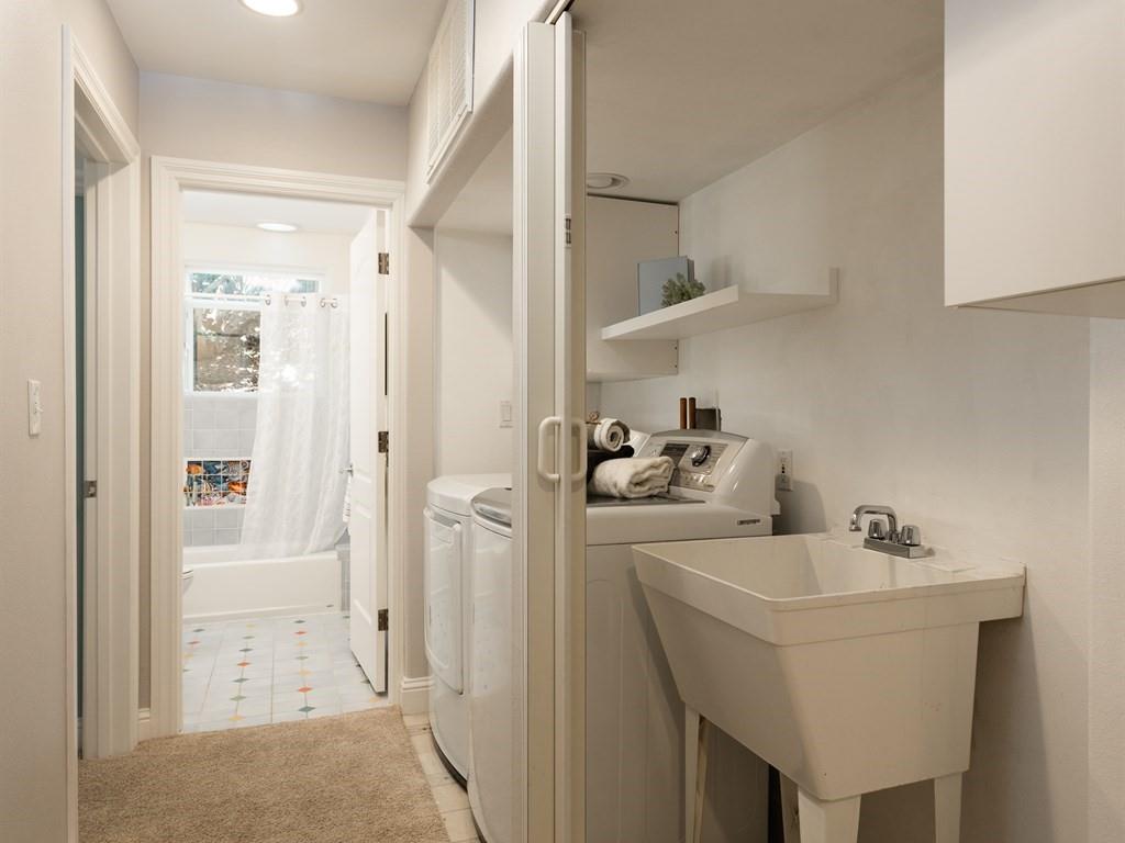 10 Kenton Avenue San Carlos, CA 94070 - Photo 18 of 25 a bathroom with a sink a mirror and shower