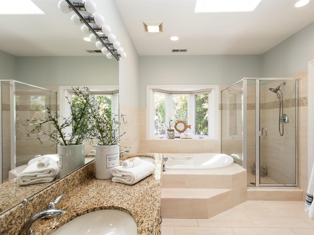 10 Kenton Avenue San Carlos, CA 94070 - Photo 21 of 25 a spacious bedroom with a granite countertop tub sink and glass door