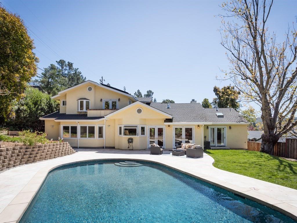 10 Kenton Avenue San Carlos, CA 94070 - Photo 24 of 25 a front view of a house with a yard table and chairs