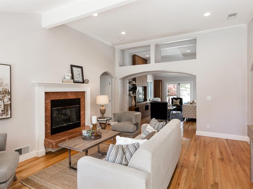 10 Kenton Avenue San Carlos, CA 94070 - Photo 3 of 25 a living room with furniture a fireplace and wooden floor
