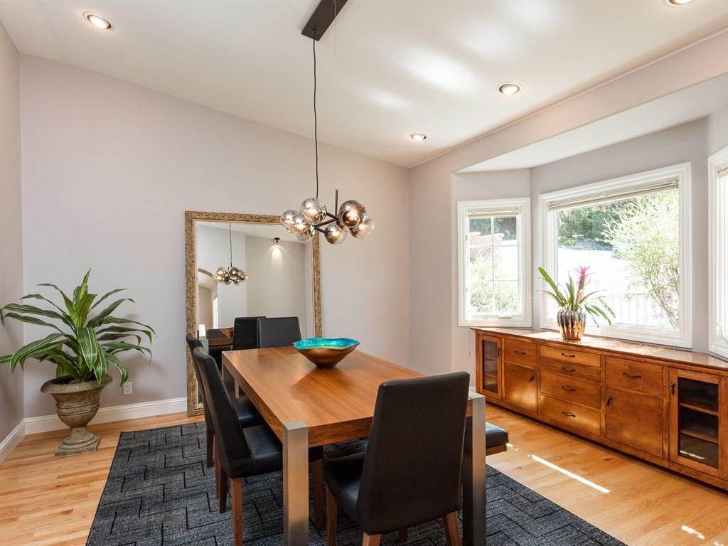 10 Kenton Avenue San Carlos, CA 94070 - Photo 6 of 25 a view of a dining room with furniture window and wooden floor
