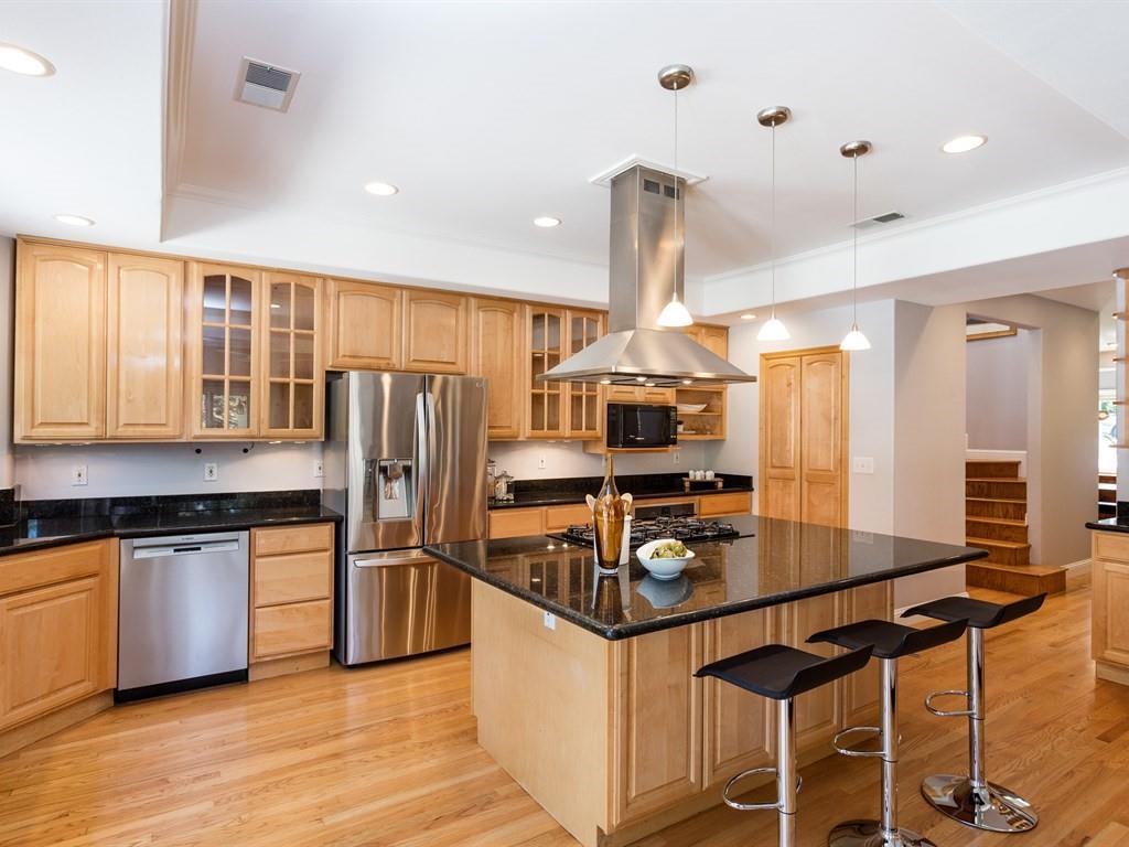 10 Kenton Avenue San Carlos, CA 94070 - Photo 10 of 25 a kitchen with stainless steel appliances a stove a sink a refrigerator and cabinets