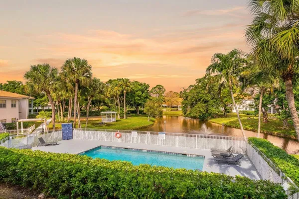 a view of a swimming pool with a patio