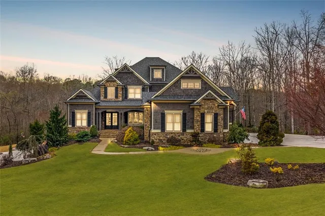 a front view of a house with a yard table and chairs