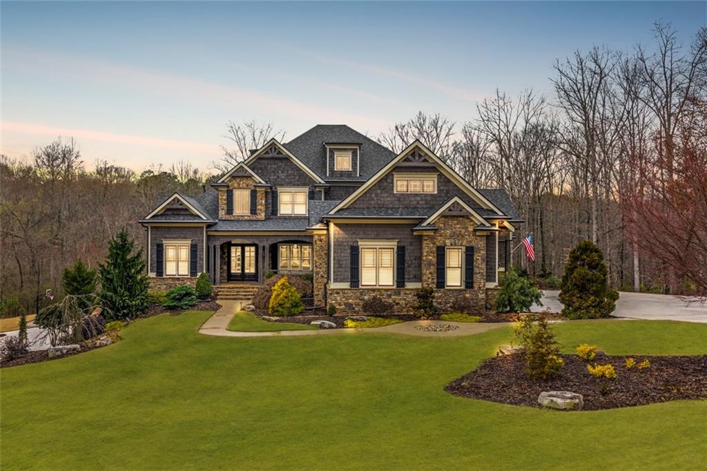a front view of a house with a yard table and chairs