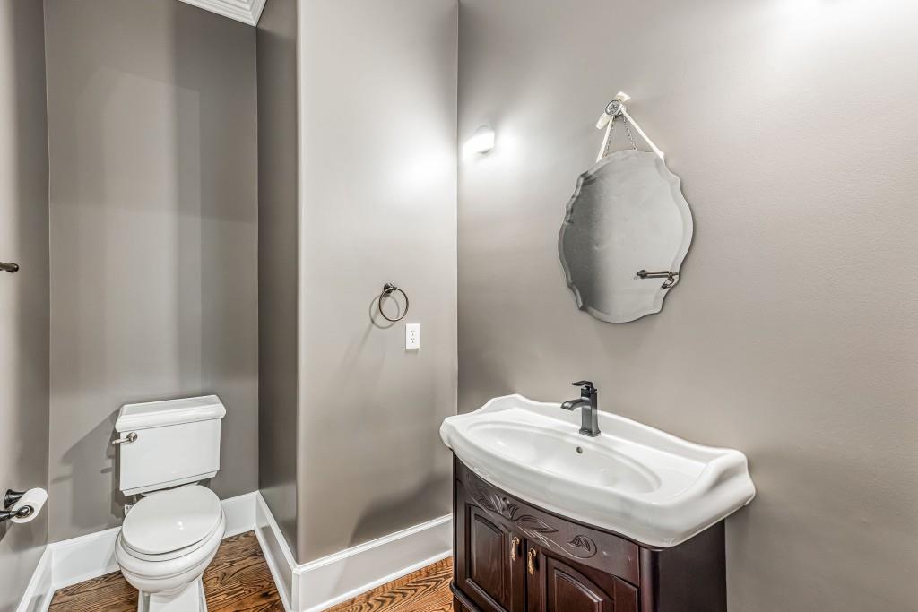 47 Fern Leaf Way Newnan, GA 30265 - Photo 28 of 65 a bathroom with a sink a toilet and a mirror