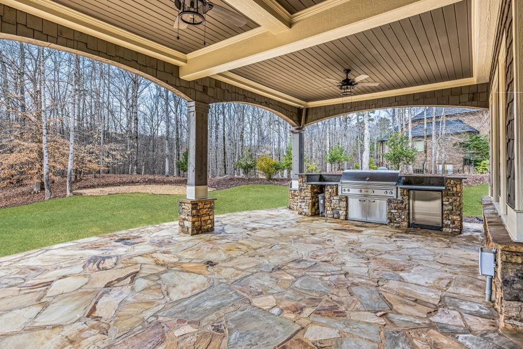 47 Fern Leaf Way Newnan, GA 30265 - Photo 61 of 65 a view of a porch with chairs and backyard