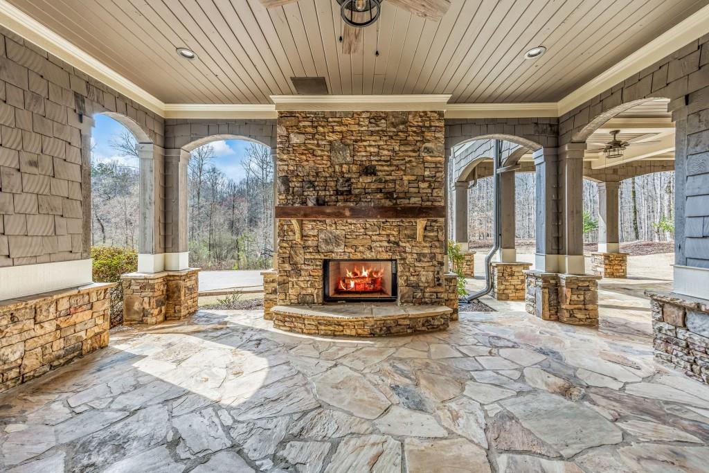 47 Fern Leaf Way Newnan, GA 30265 - Photo 65 of 65 a living room with furniture a fireplace and a table