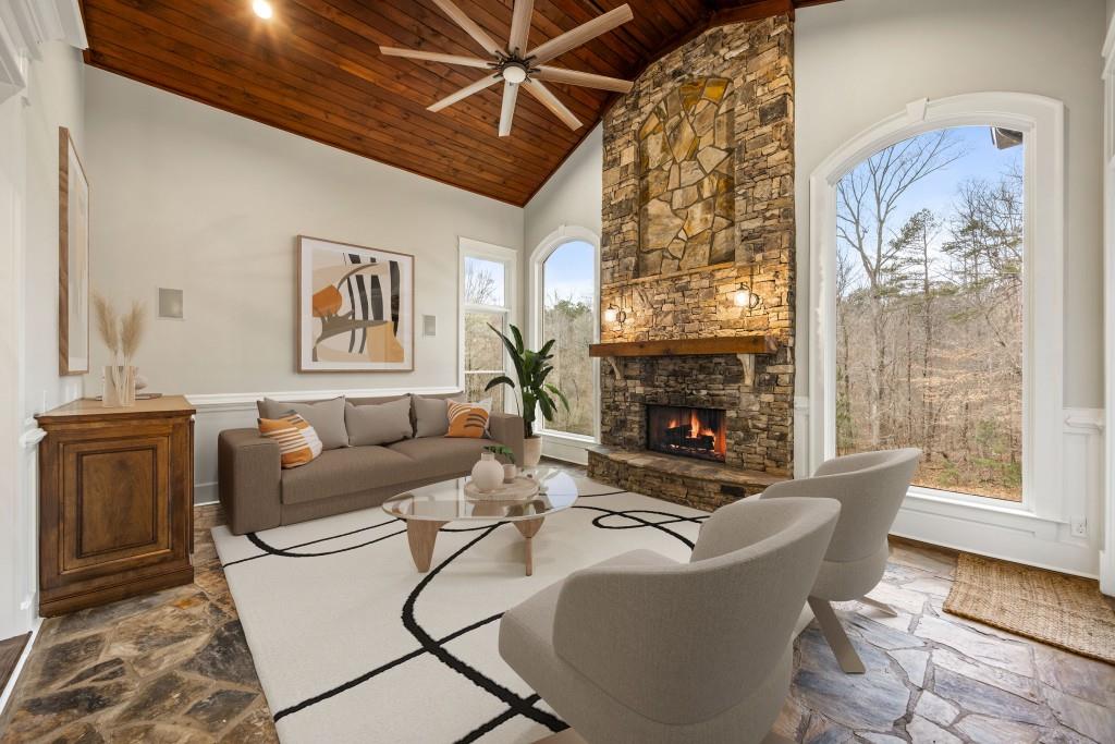 47 Fern Leaf Way Newnan, GA 30265 - Photo 10 of 65 a living room with furniture a fireplace and a window