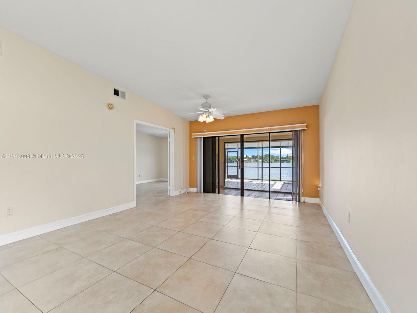 19233 Northwest 64th Court Hialeah, FL 33015 - Photo 11 of 34 a view of an empty room with a window