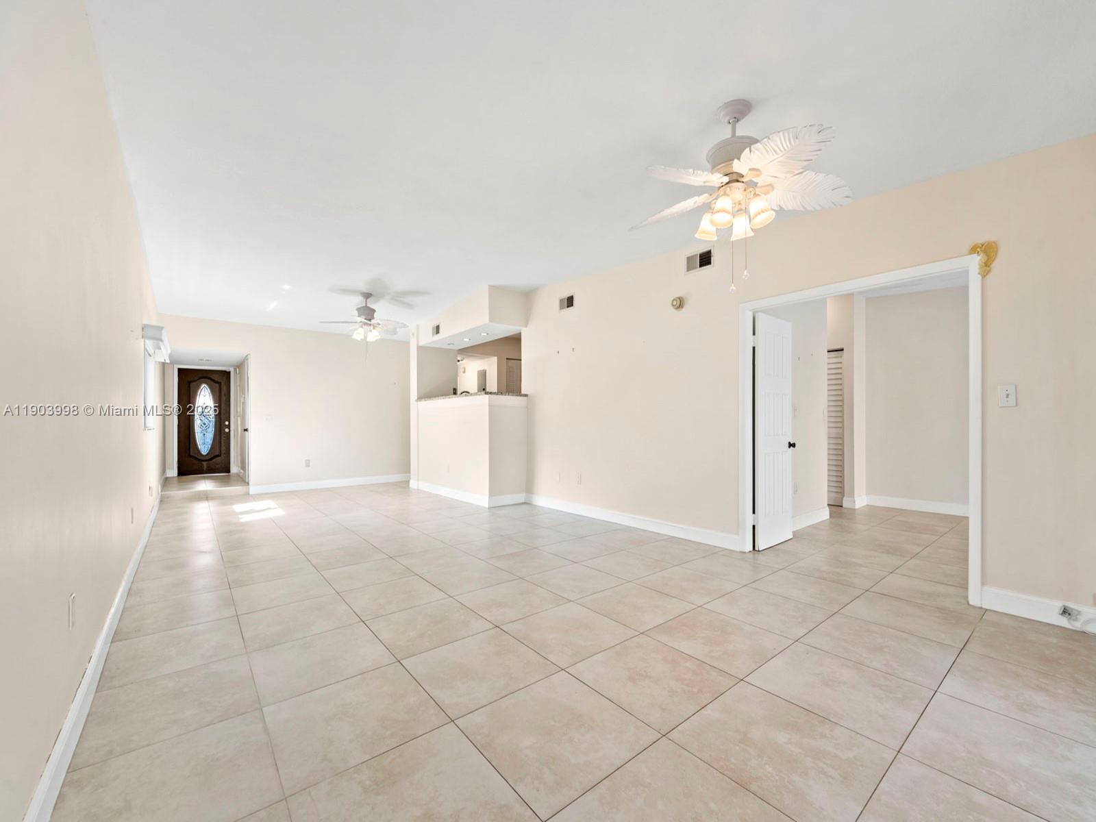 19233 Northwest 64th Court Hialeah, FL 33015 - Photo 12 of 34 a view of a livingroom with a fireplace