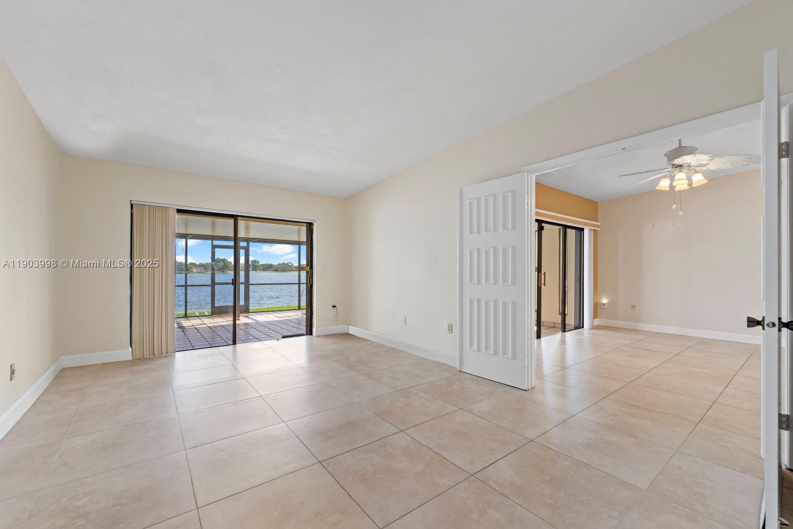 19233 Northwest 64th Court Hialeah, FL 33015 - Photo 14 of 34 a view of an empty room with a window