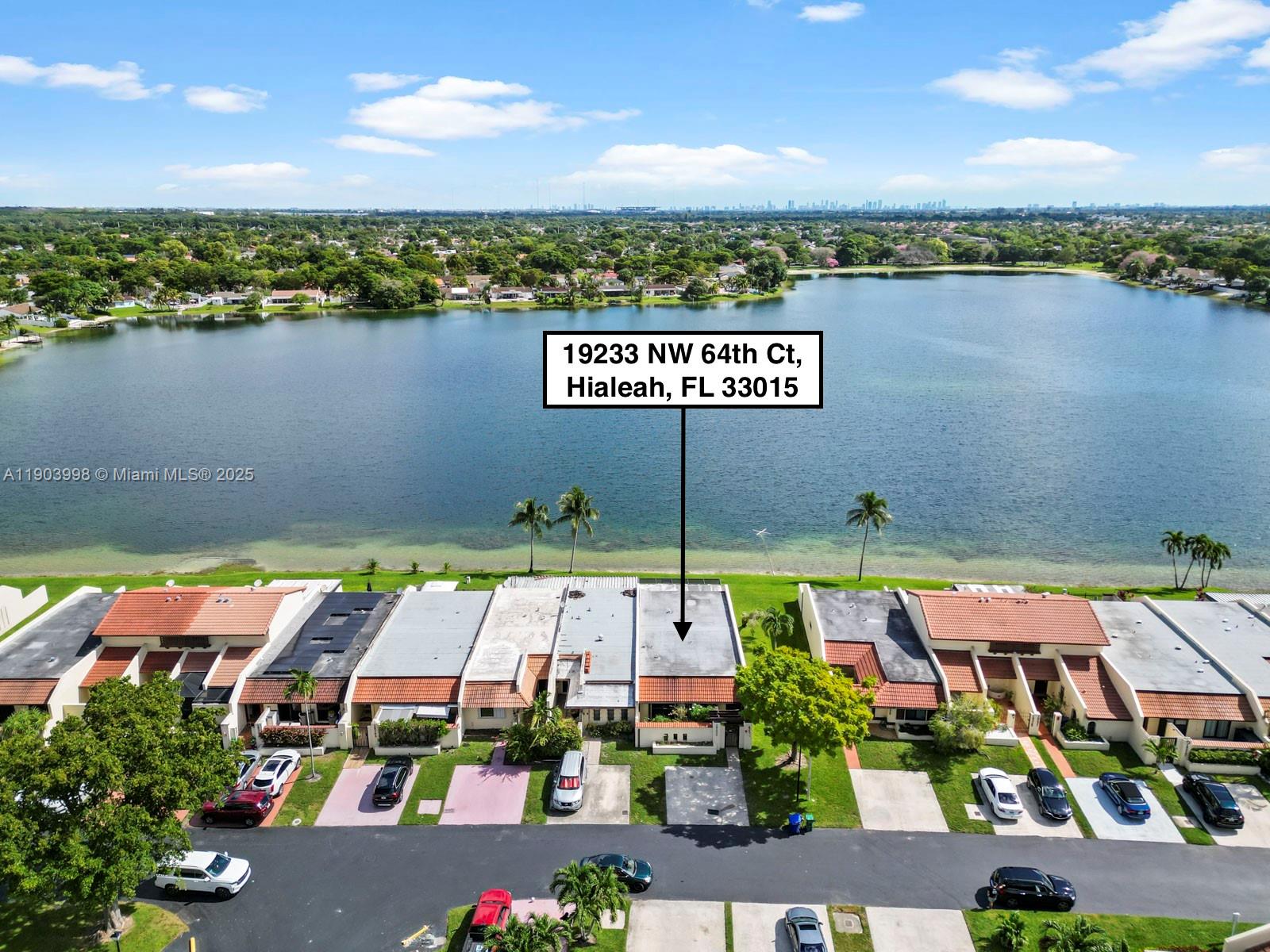 19233 Northwest 64th Court Hialeah, FL 33015 - Photo 2 of 34 an aerial view of a city