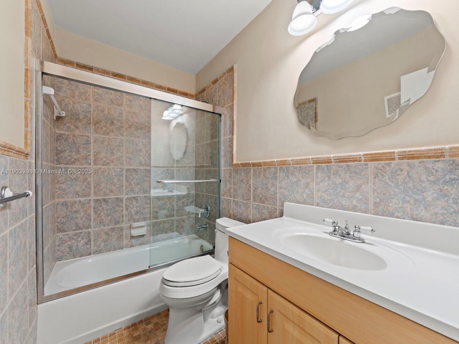19233 Northwest 64th Court Hialeah, FL 33015 - Photo 25 of 34 a bathroom with a sink a toilet and shower