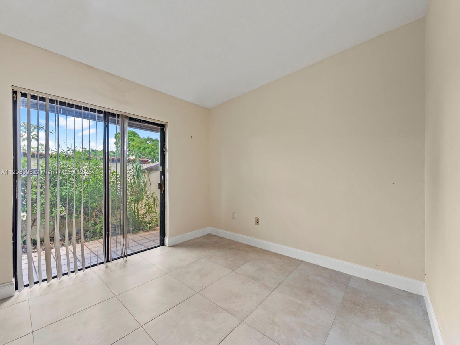 19233 Northwest 64th Court Hialeah, FL 33015 - Photo 26 of 34 a view of an empty room with a balcony