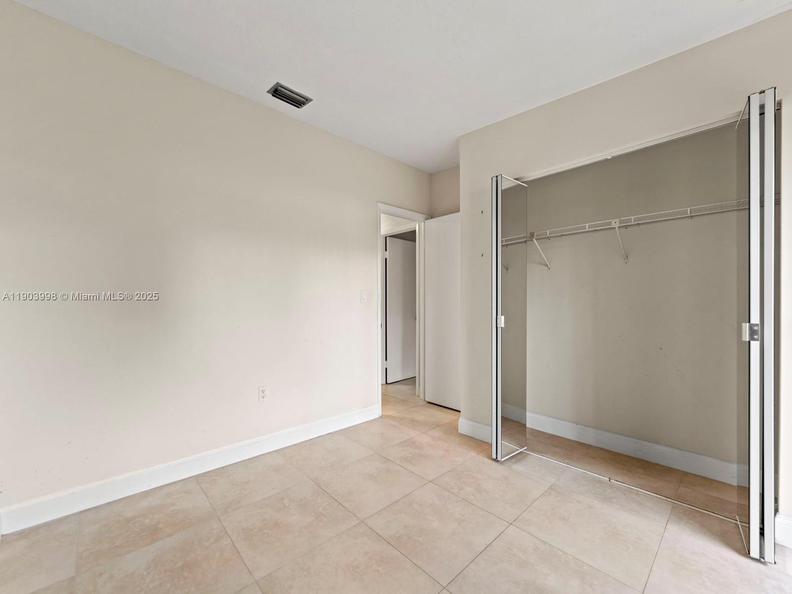19233 Northwest 64th Court Hialeah, FL 33015 - Photo 27 of 34 a view of an empty room