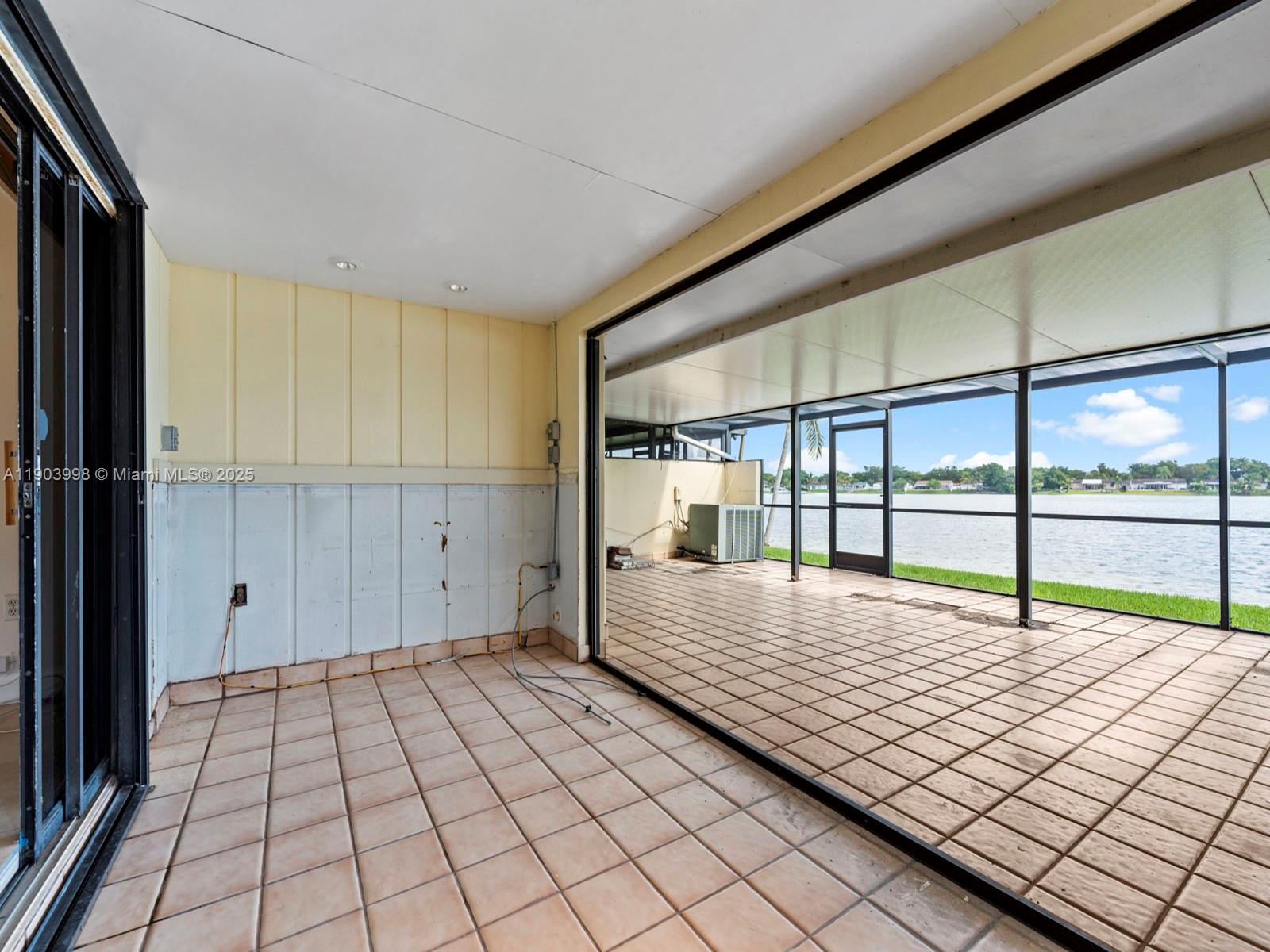 19233 Northwest 64th Court Hialeah, FL 33015 - Photo 29 of 34 a view of empty room with wooden floor