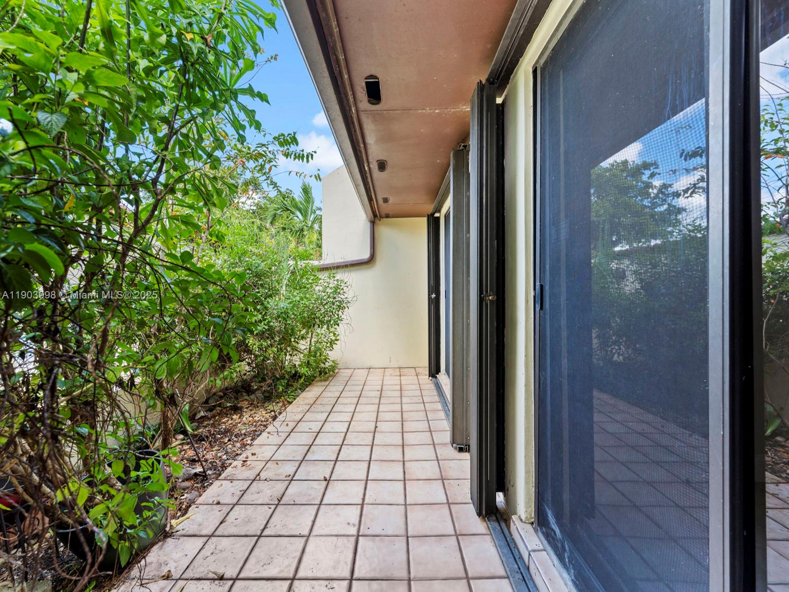 19233 Northwest 64th Court Hialeah, FL 33015 - Photo 34 of 34 a view of a pathway both side of house