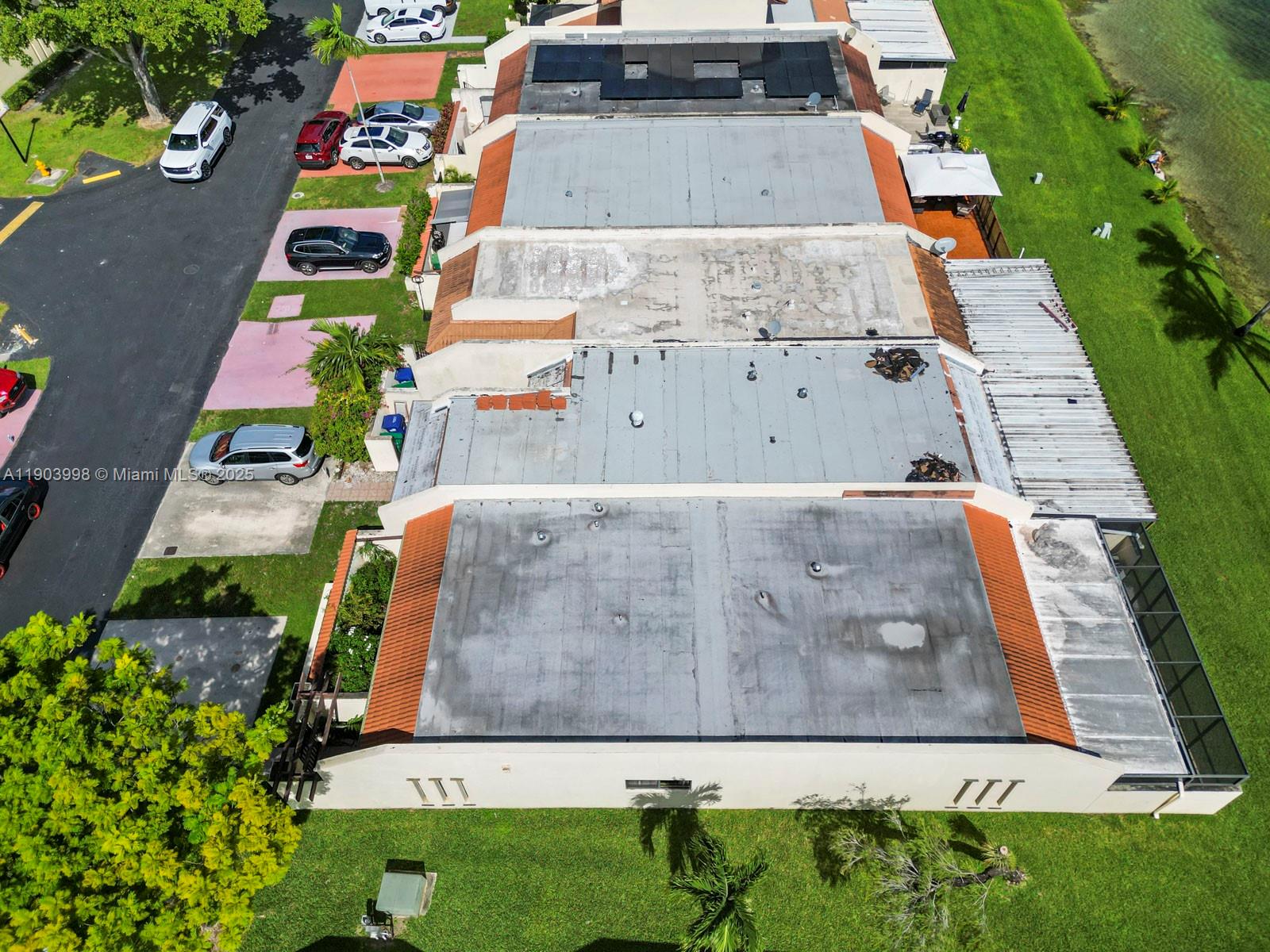 19233 Northwest 64th Court Hialeah, FL 33015 - Photo 5 of 34 an aerial view of residential houses with outdoor space and trees