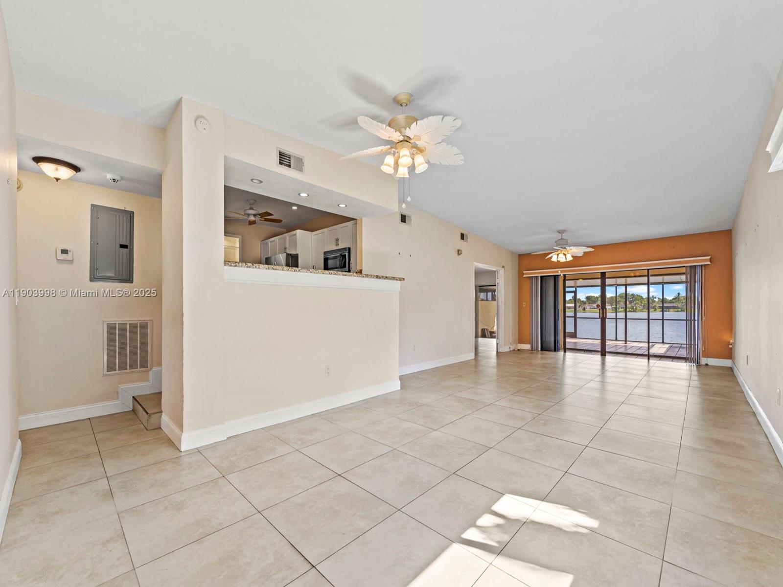 19233 Northwest 64th Court Hialeah, FL 33015 - Photo 9 of 34 a view of an empty room with a window