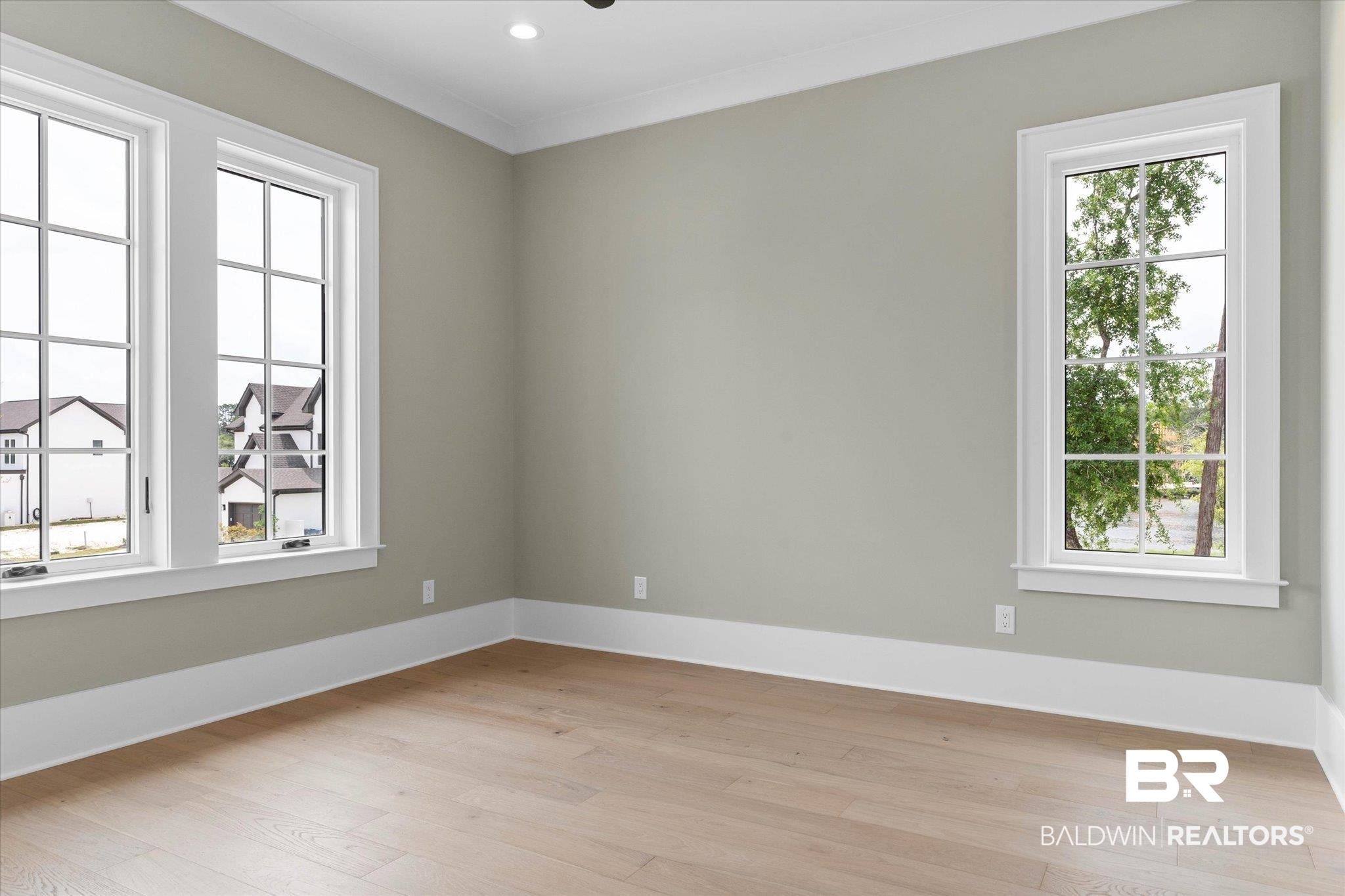 853 Inlet Circle Gulf Shores, AL 36542 - Photo 28 of 55 Empty room featuring crown molding, baseboards, and light wood-style flooring