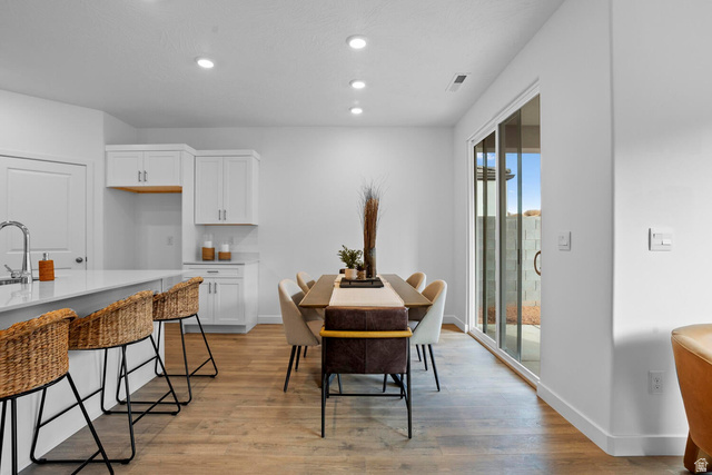 1624 South Staircase Way, Unit 4183 Washington, UT 84780 - Photo 19 of 47 Open-concept living space featuring wood-finish flooring, recessed lighting, and a sliding glass door