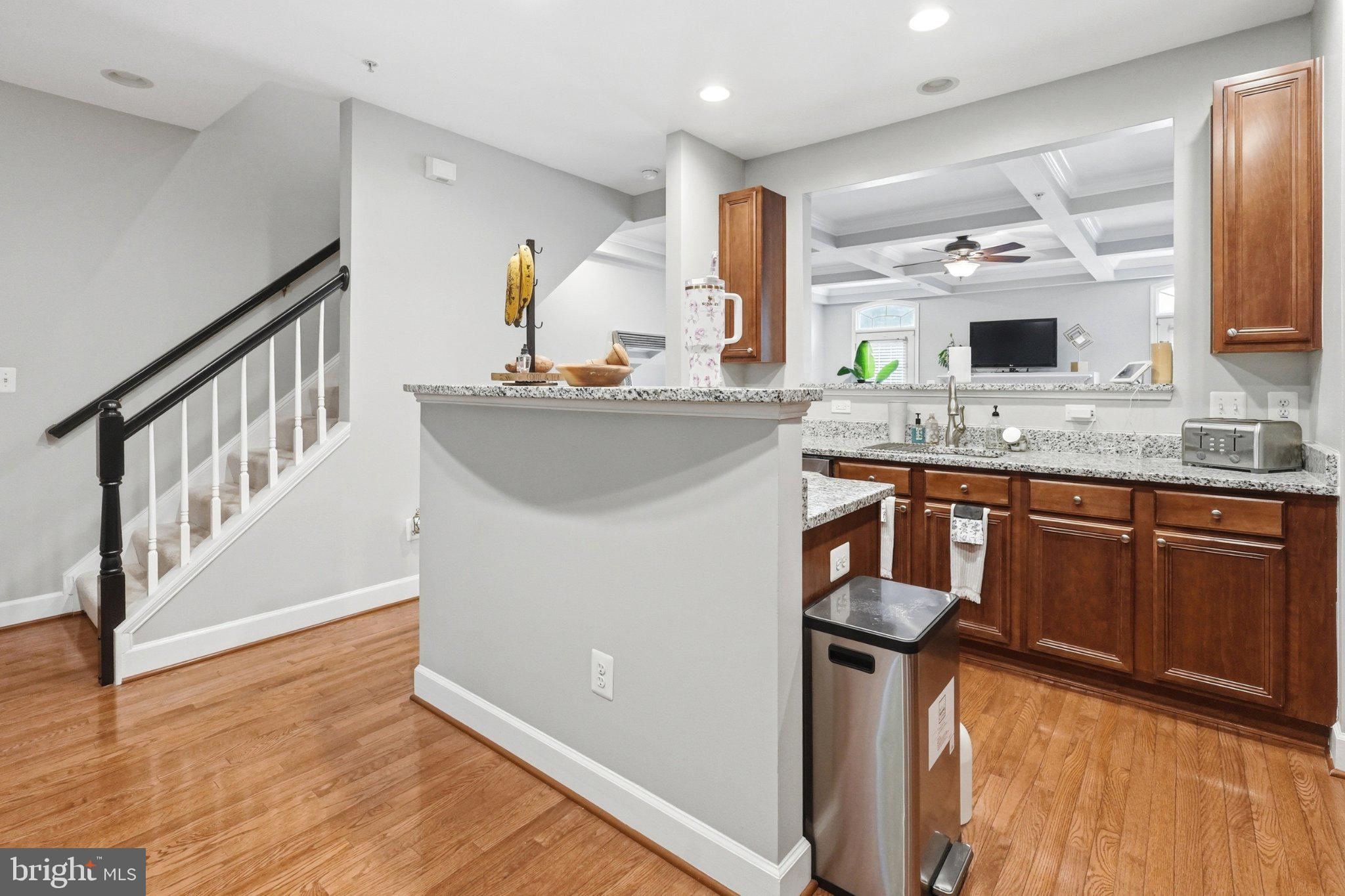 772 Raven Avenue Gaithersburg, MD 20877 - Photo 16 of 30 a kitchen with stainless steel appliances granite countertop a sink stove and cabinets