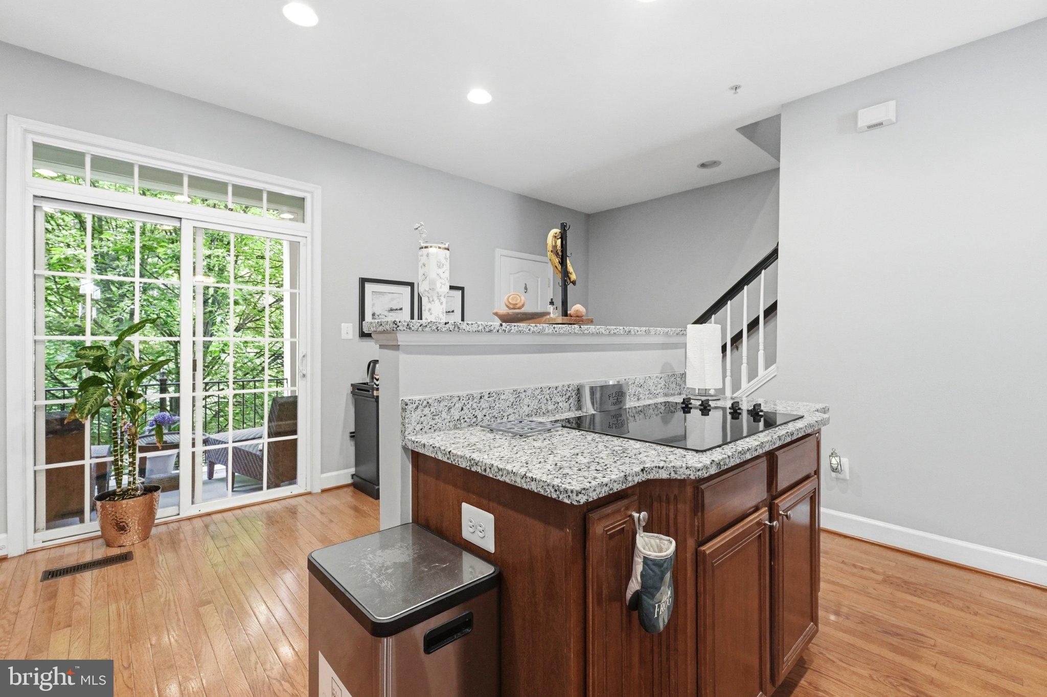 772 Raven Avenue Gaithersburg, MD 20877 - Photo 17 of 30 a kitchen with a sink a window and wooden floor
