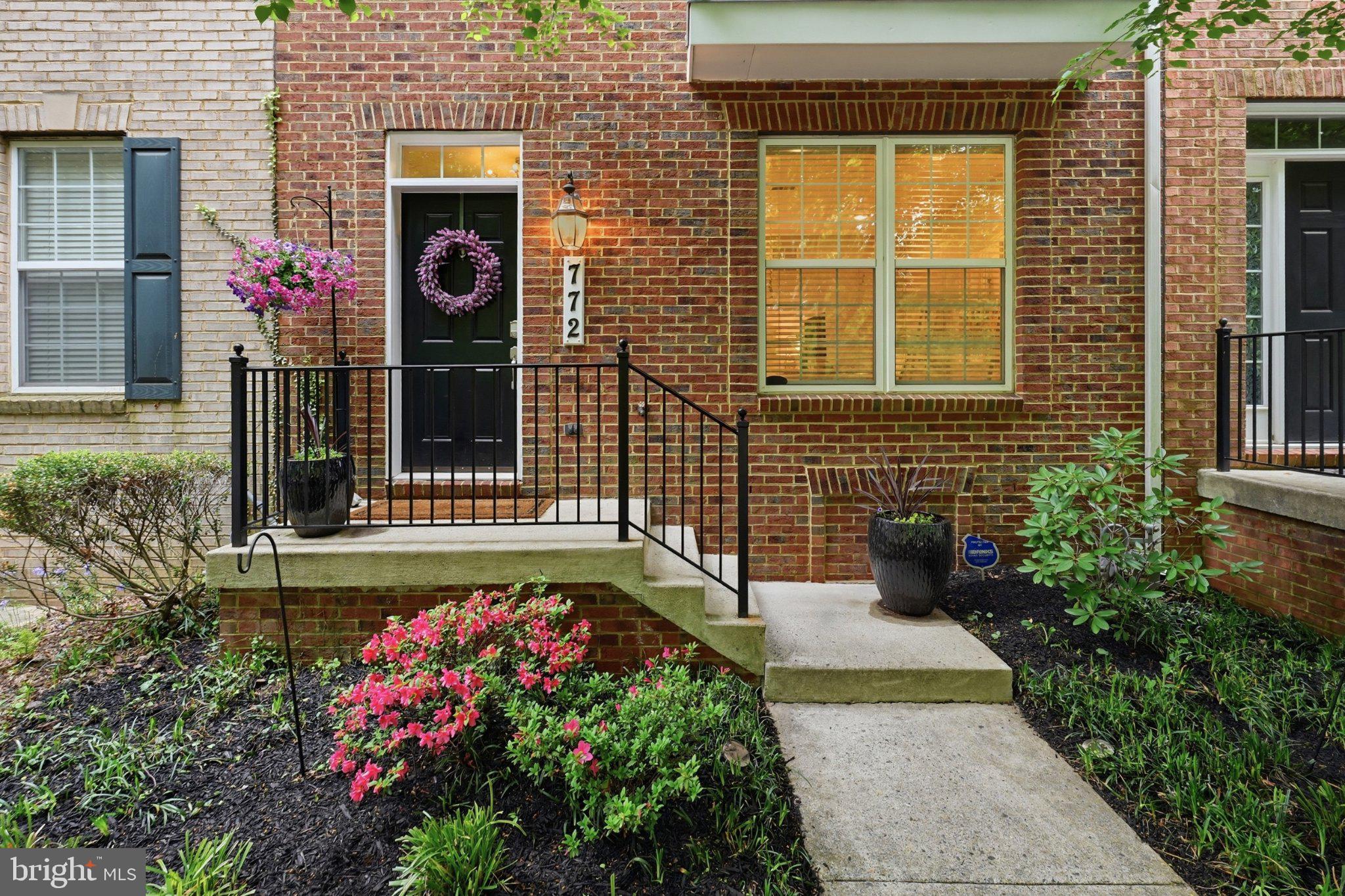 772 Raven Avenue Gaithersburg, MD 20877 - Photo 2 of 30 a front view of a house with a flower garden