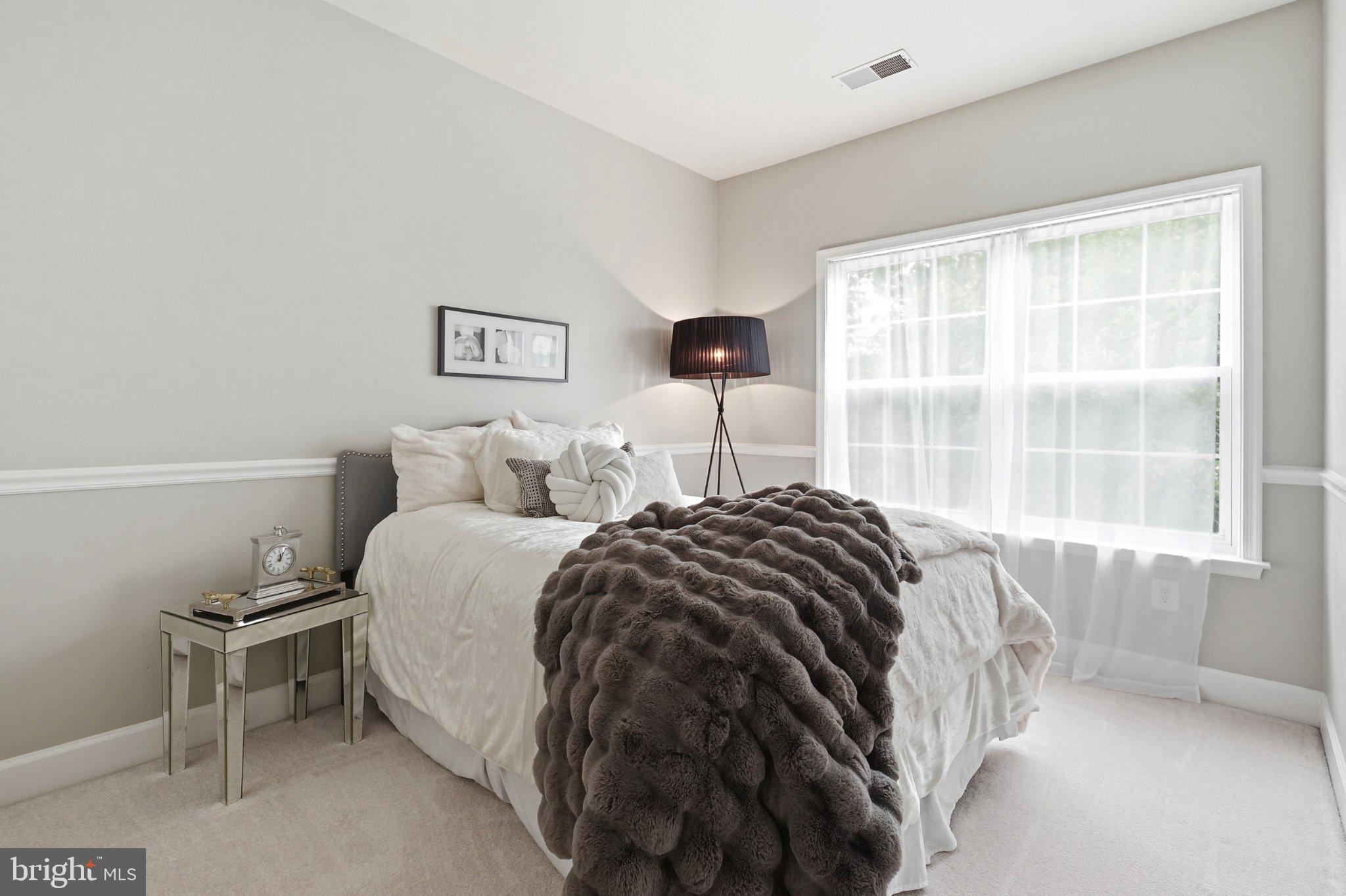 772 Raven Avenue Gaithersburg, MD 20877 - Photo 22 of 30 a bedroom with a bed and a window