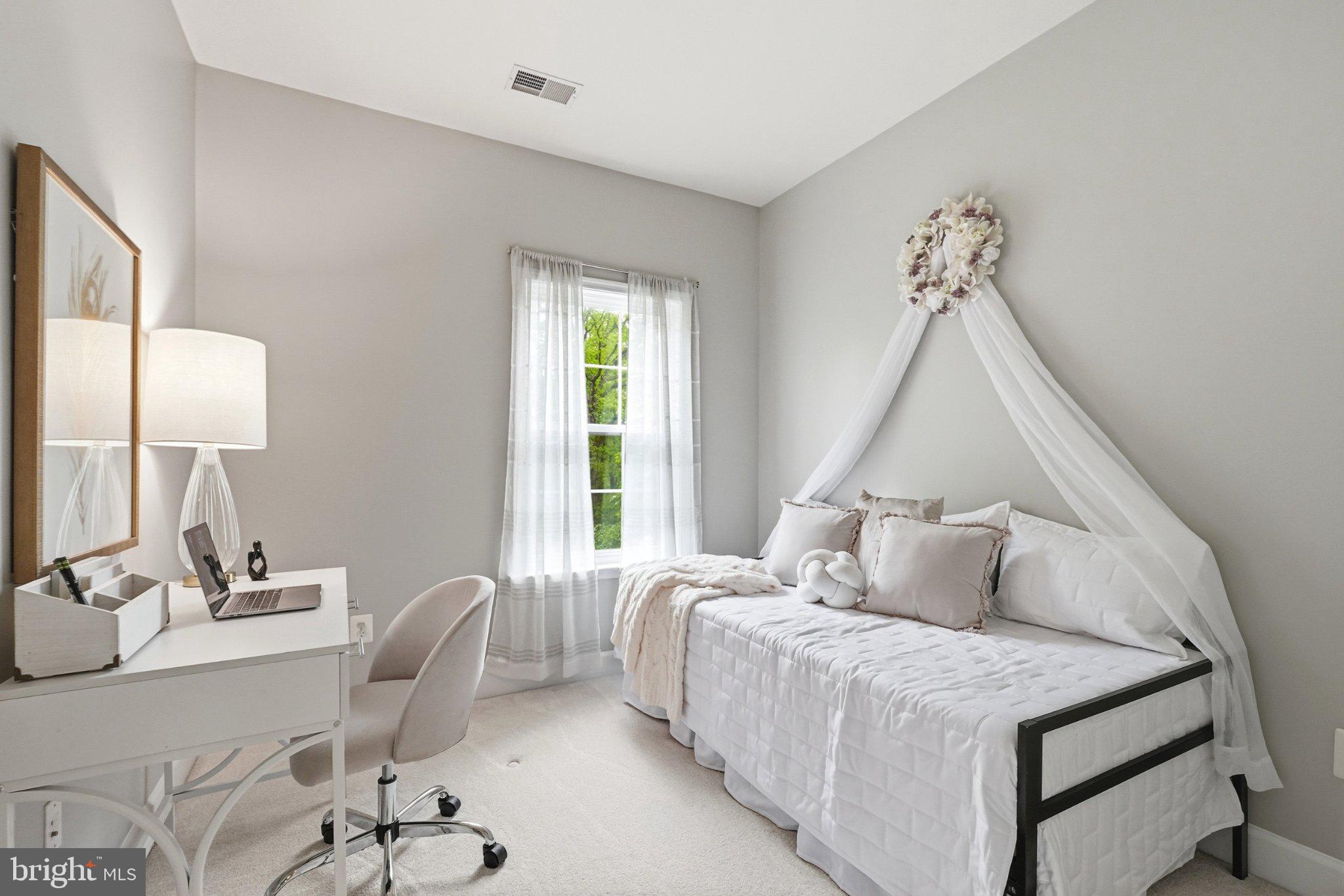 772 Raven Avenue Gaithersburg, MD 20877 - Photo 23 of 30 a bedroom with a bed and a table