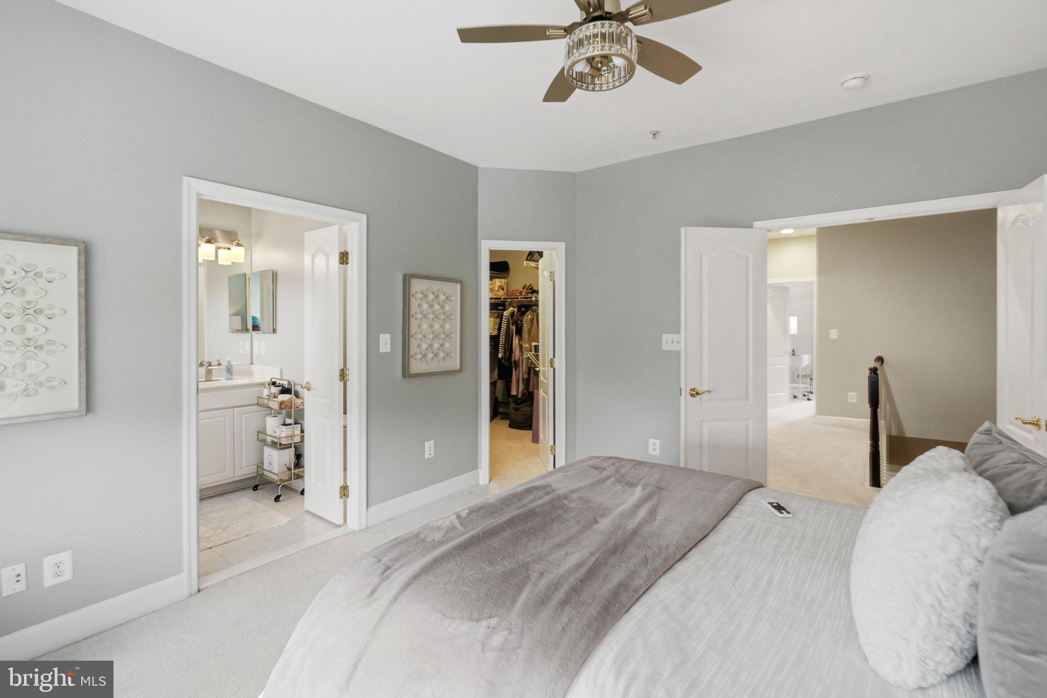 772 Raven Avenue Gaithersburg, MD 20877 - Photo 25 of 30 a bedroom with a bed and a chandelier