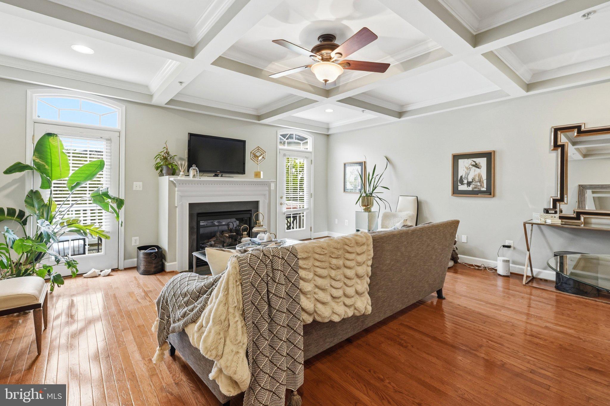772 Raven Avenue Gaithersburg, MD 20877 - Photo 10 of 30 a living room with furniture fireplace and a flat screen tv