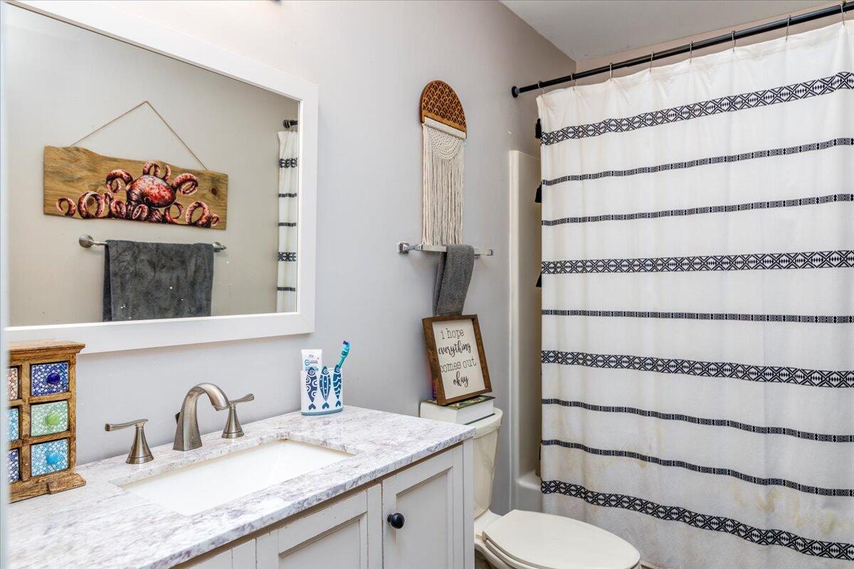 148 Cobblestone Drive Lynchburg, VA 24502 - Photo 15 of 30 a bathroom with a granite countertop sink and a mirror