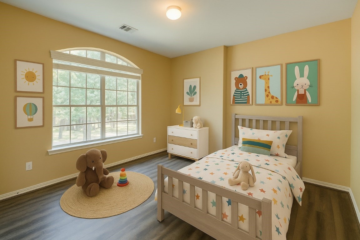 4411 Enchanted Spring Court Sugar Land, TX 77479 - Photo 13 of 21 a bedroom with a bed and wooden floor