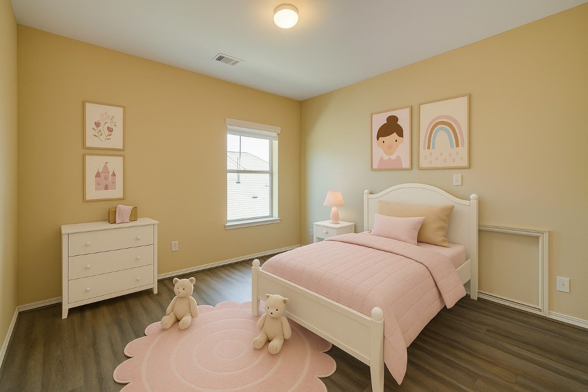 4411 Enchanted Spring Court Sugar Land, TX 77479 - Photo 14 of 21 a bedroom with a bed and a chair