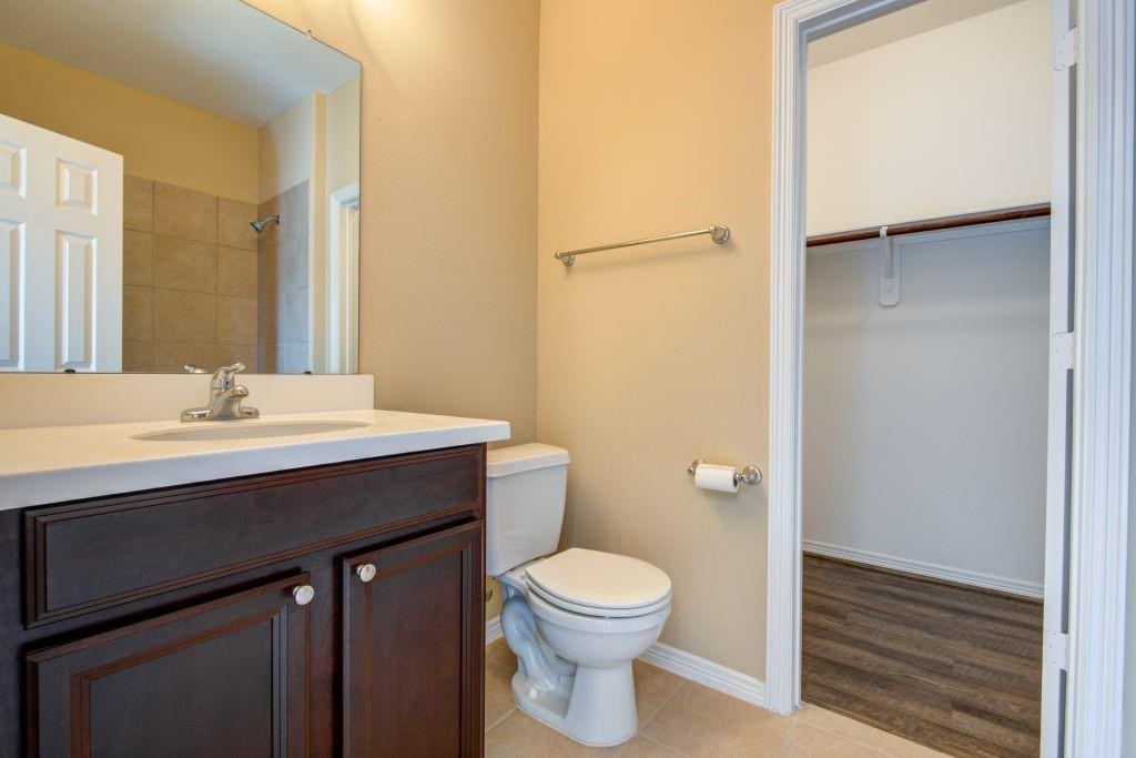 4411 Enchanted Spring Court Sugar Land, TX 77479 - Photo 16 of 21 a bathroom with a sink a toilet and shower