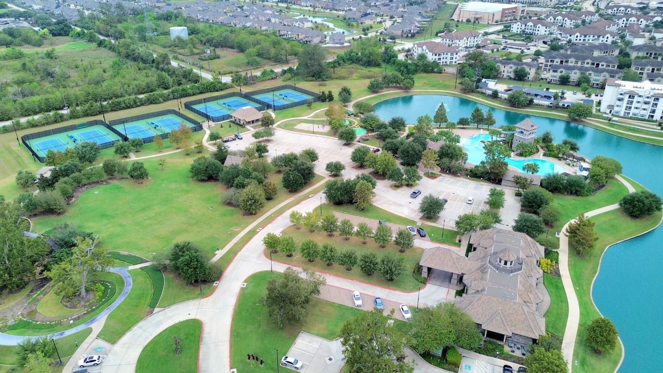 4411 Enchanted Spring Court Sugar Land, TX 77479 - Photo 20 of 21 an aerial view of lake residential houses with outdoor space and lake view