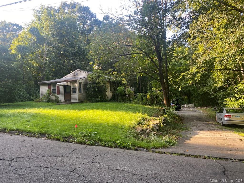 26 Fenn Road Middlebury, CT 06762 - Photo 1 of 1 a front view of a house with garden