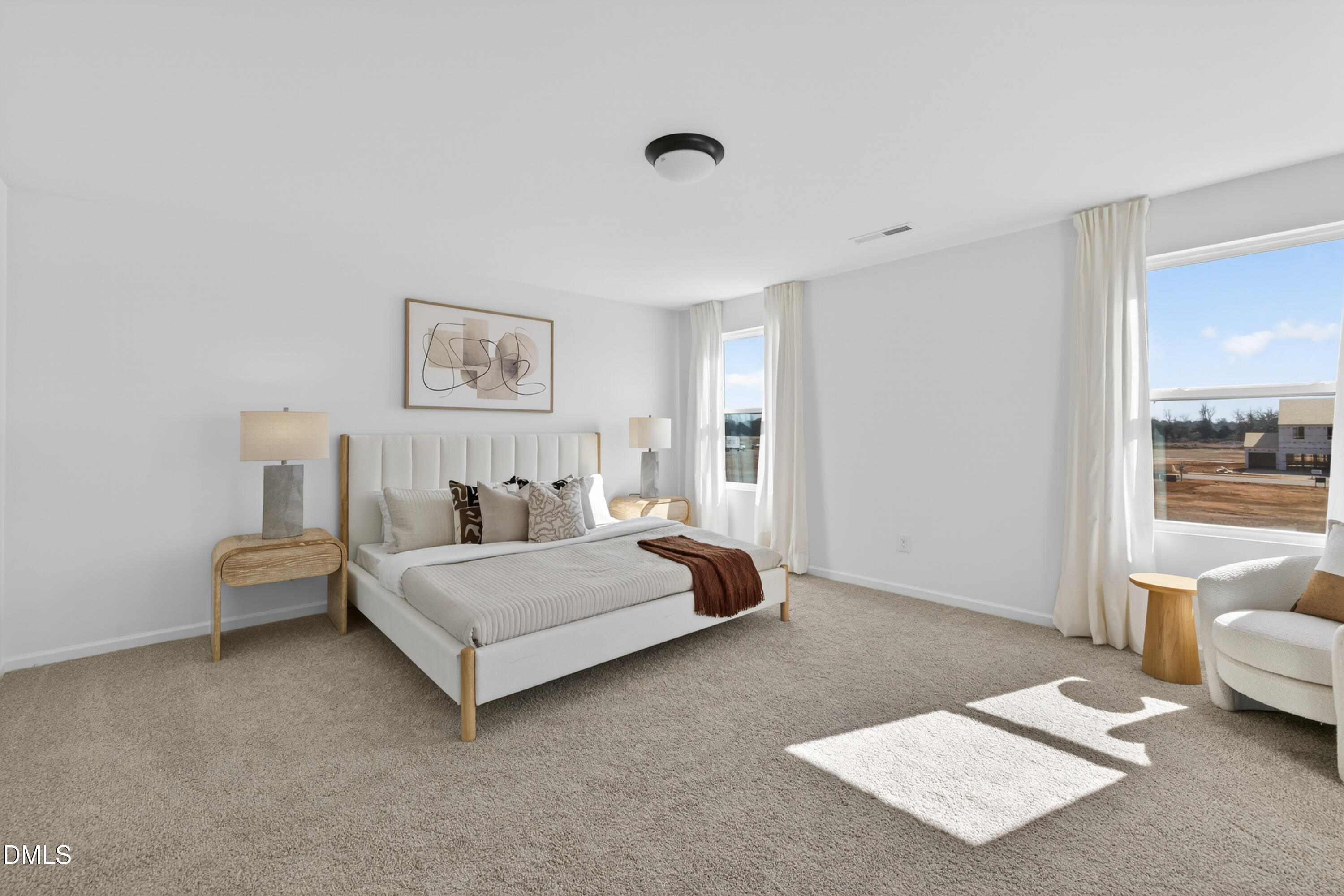 415 Plentiful Way, Unit 108 Benson, NC 27504 - Photo 15 of 31 a spacious bedroom with a bed and a couch