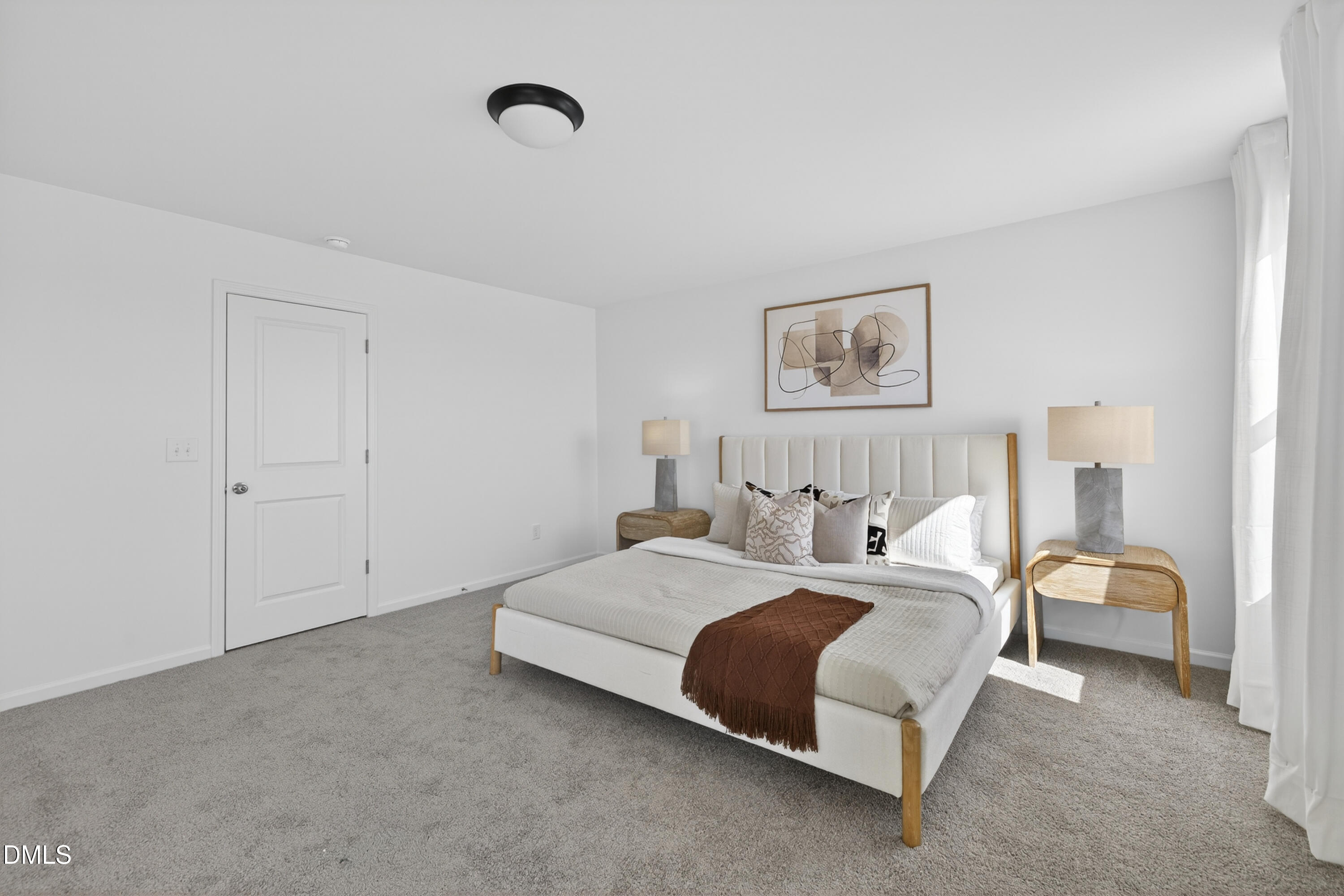 415 Plentiful Way, Unit 108 Benson, NC 27504 - Photo 16 of 31 a spacious bedroom with a bed and a couch