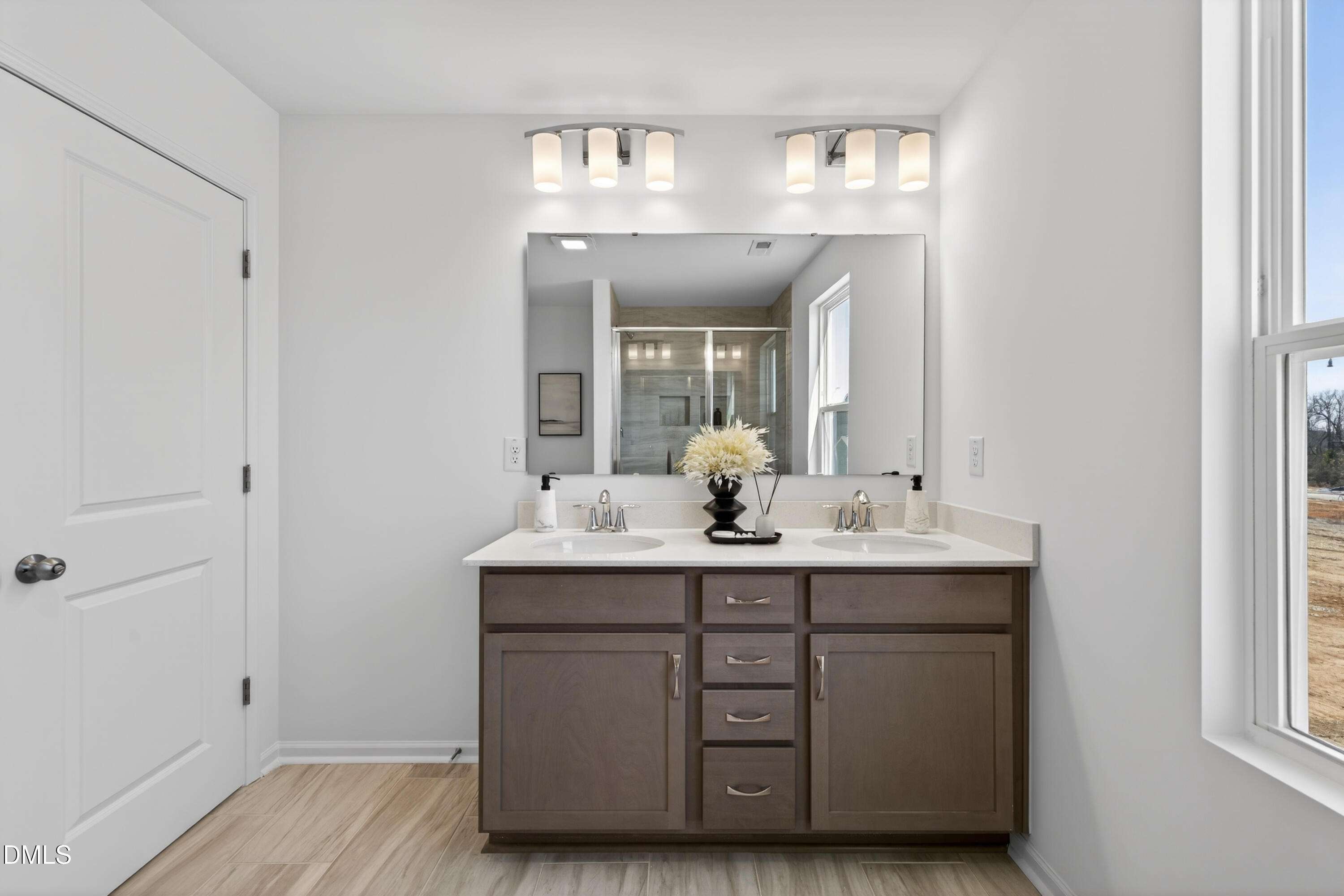 415 Plentiful Way, Unit 108 Benson, NC 27504 - Photo 20 of 31 a bathroom with a sink and a mirror
