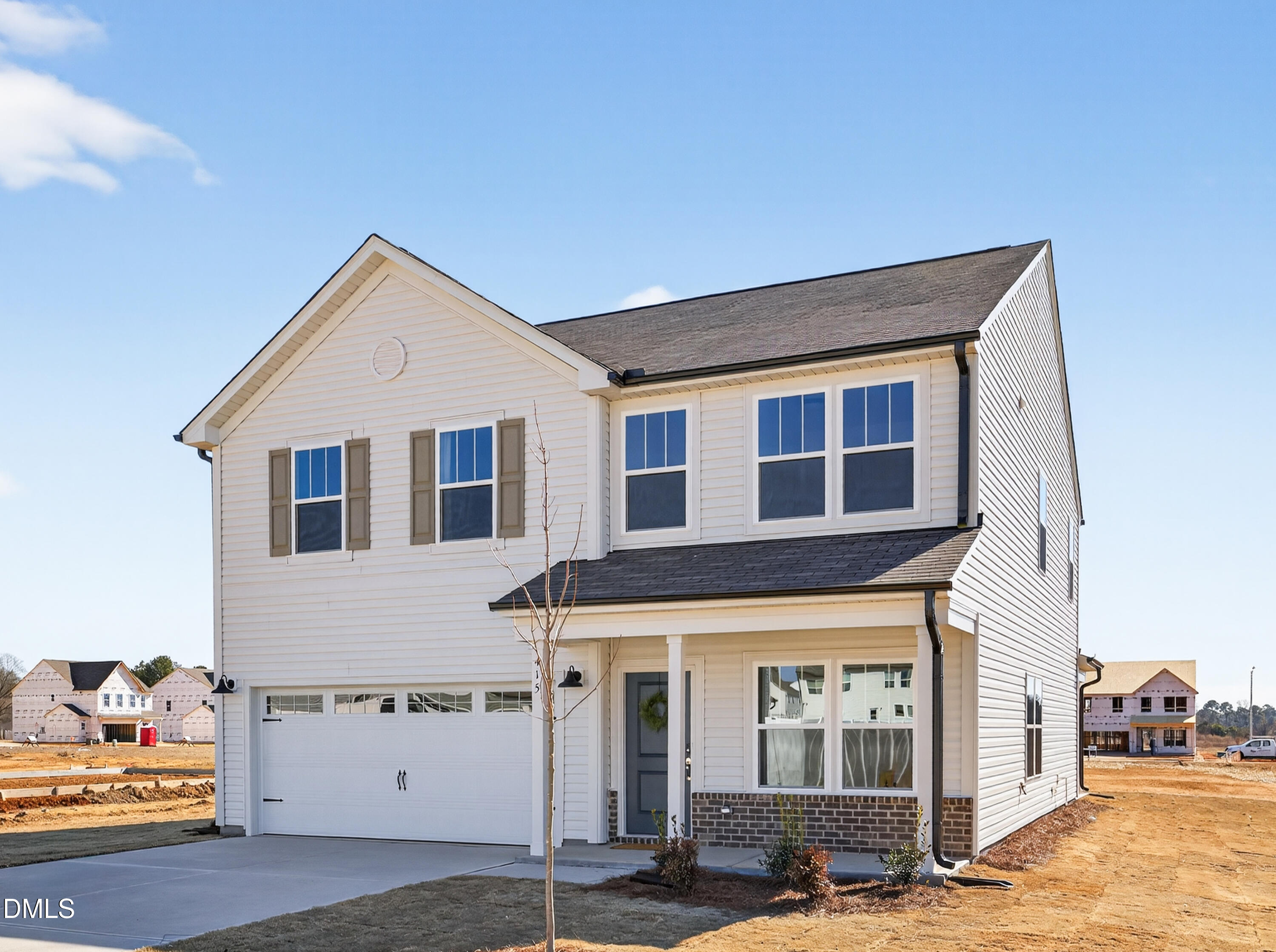 415 Plentiful Way, Unit 108 Benson, NC 27504 - Photo 2 of 31 a front view of a house with parking