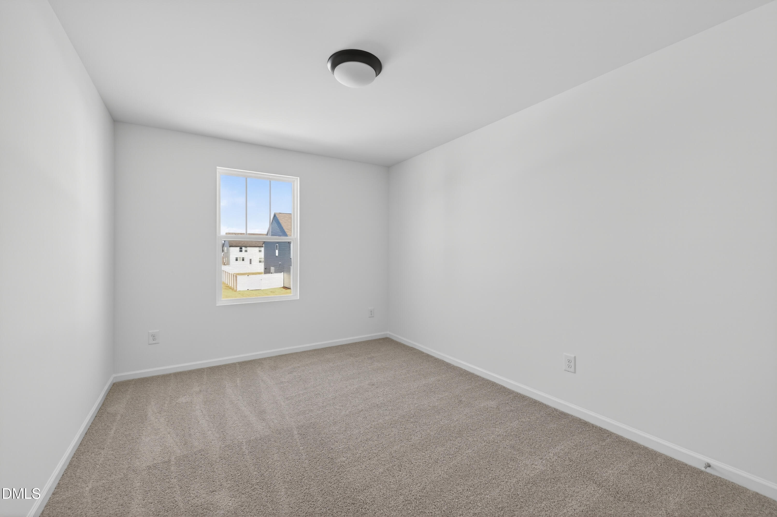 415 Plentiful Way, Unit 108 Benson, NC 27504 - Photo 25 of 31 a view of an empty room with a window