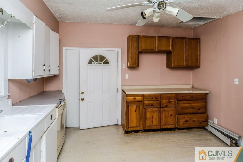 78 Old Road Princeton, NJ 08540 - Photo 6 of 20 a kitchen with stainless steel appliances a stove a sink and a refrigerator
