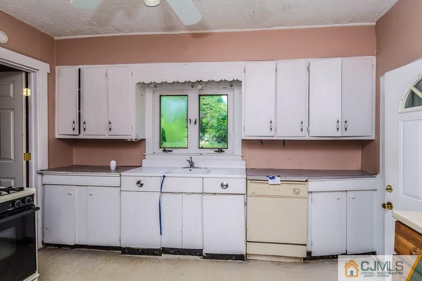 78 Old Road Princeton, NJ 08540 - Photo 7 of 20 a kitchen with white cabinets and sink