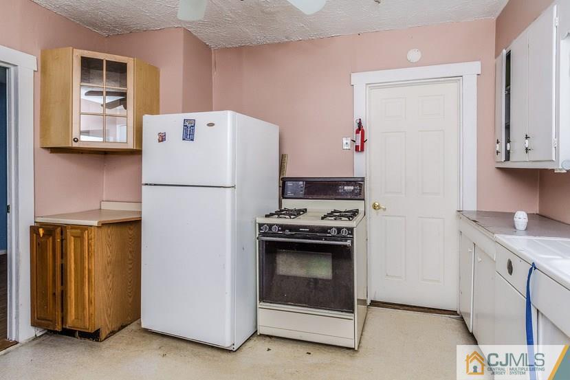 78 Old Road Princeton, NJ 08540 - Photo 8 of 20 a kitchen with stainless steel appliances granite countertop a refrigerator sink and stove