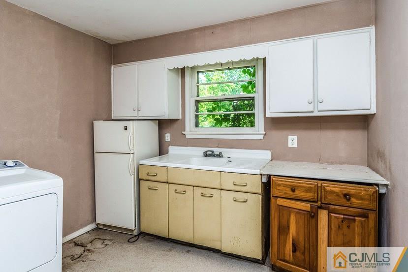 78 Old Road Princeton, NJ 08540 - Photo 9 of 20 a kitchen with cabinets appliances a sink and a window